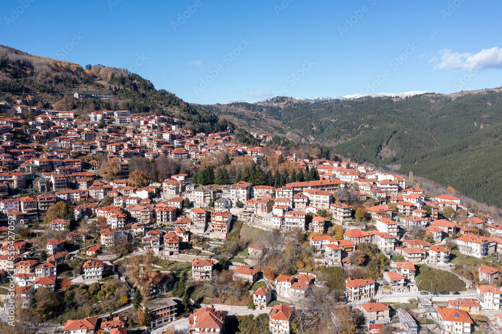 Fototapeta premium Metsovo village, Epirus Greece. Aerial drone view of traditional red tile roof house on the mountain.