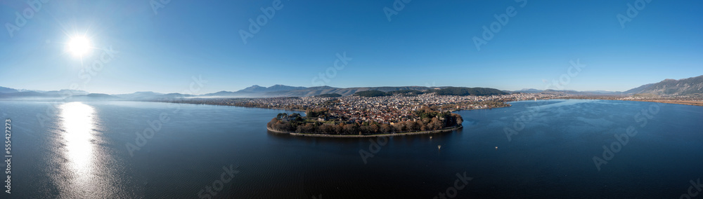 Greece, Ioannina  city. Aerial view panorama of Giannena and Lake Pamvotis, blue sky.