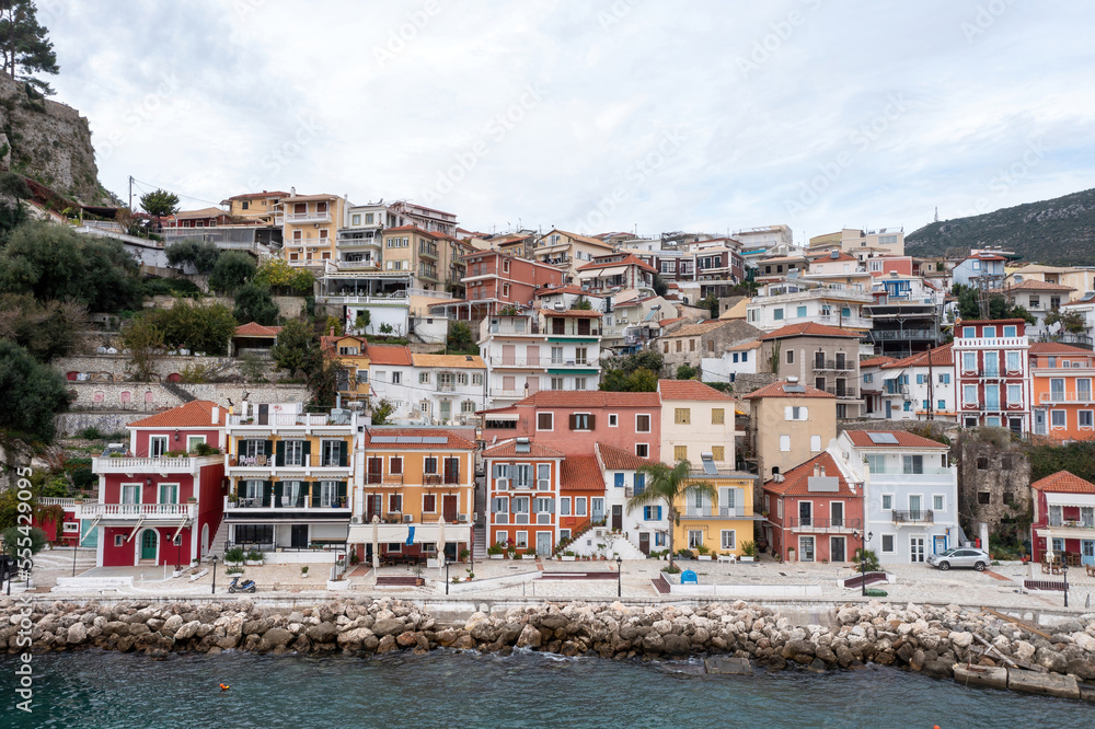 Parga, Greece. Traditional Ionian coast city colorful facade waterfront buildings on the hill