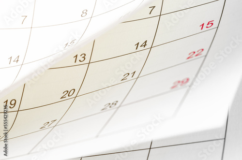 Foto A Calendar page flipping sheet close up blur background business schedule planni