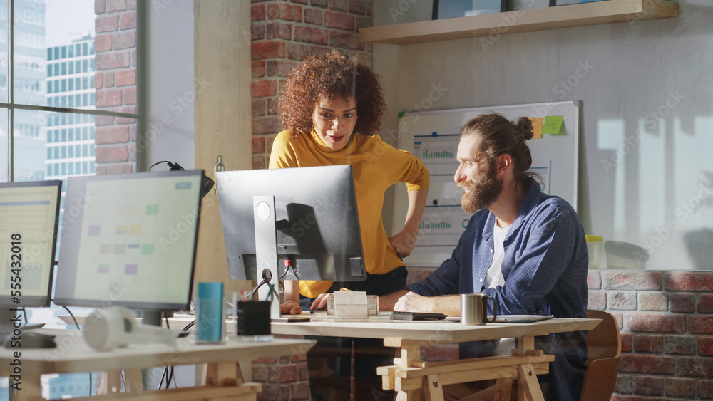 © Gorodenkoff - Two Creative Multicultural Colleagues Collaborate on a Project and Work Together as a Team. Marketing Manager and Designer Talking and Discussing Changes to an Advertising Campaign for a Startup. © Gorodenkoff - Two Creative Multicultural Colleagues Collaborate on a Project and Work Together as a Team. Marketing Manager and Designer Talking and Discussing Changes to an Advertising Campaign for a Startup.