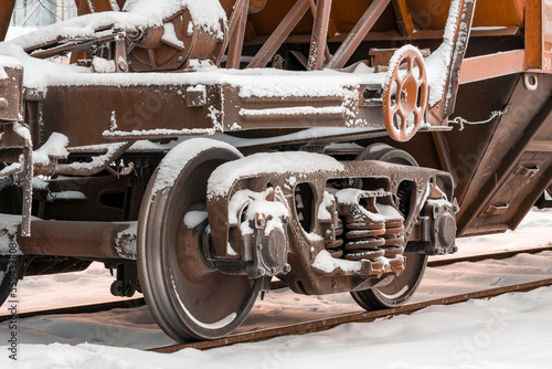 A close up view of the wheels of a cargo train