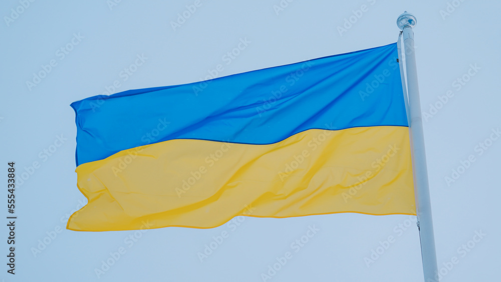 Ukrainian Flag close up view with sky background Ukrainian Flag close up view with sky background