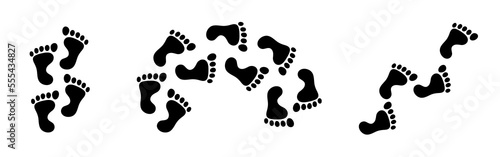 Bigfoot footprints on the ground. Path from traces. Vector black footprints isolated on white background.
