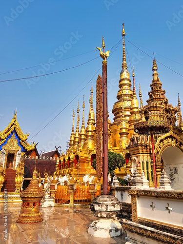 Golden pagodas and temple buildings at the buddhist temple Wat Phra That Suthon Mongkhon Khiri in Phrae  northern Thailand 
