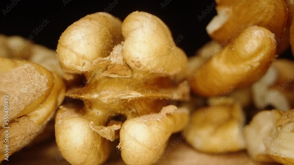 Peeled Pecans on a Wooden Table. Dolly Slider Extreme close-up inside. Peeled Pecans on a Wooden Table. Dolly Slider Extreme close-up inside.