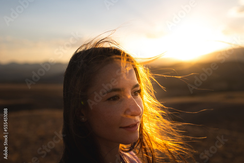 Young girl with sunset rays. © zhukovvvlad