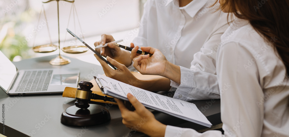 Male lawyer working with contract papers and wooden gavel on tabel in courtroom. justice and law ,attorney, court judge, concept.