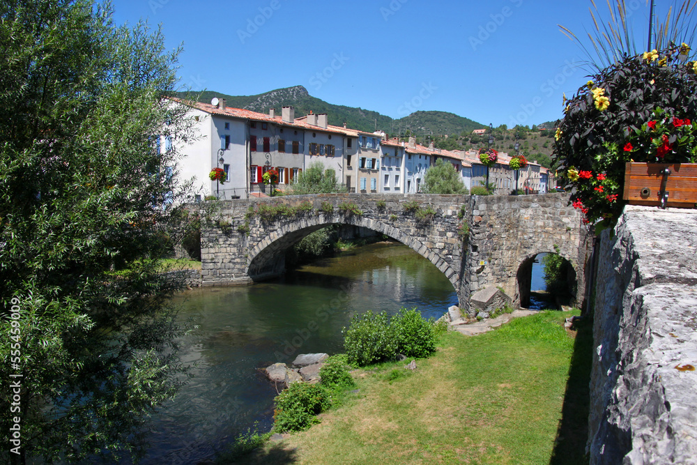 Aude river cityscape with medieval stone bridge in the old town of Quillan, France