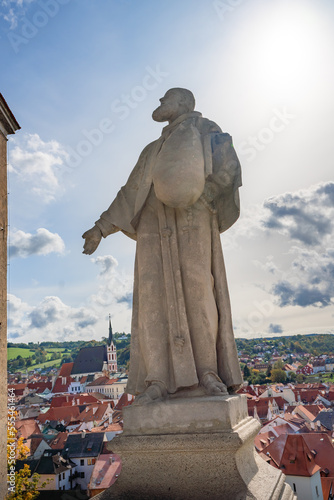 Saint Felix of Cantalice Statue at Cloak Bridge of Cesky Krumlov Castle - Cesky Krumlov, Czech Republic photo