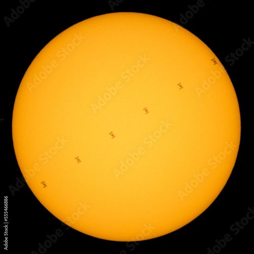 Silhouette of the International Space Station, as it transits the Sun around five miles per second. Digitally enhanced. Elements of this image furnished by NASA.  