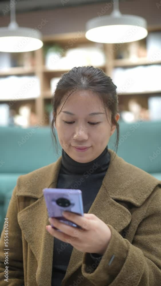 young female using mobile phone young female using mobile phone