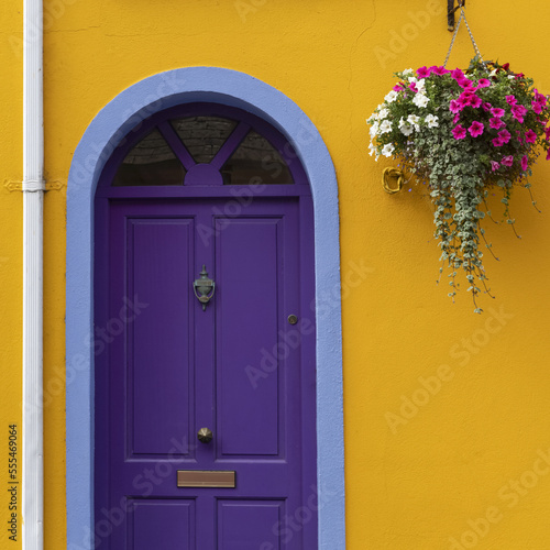 Purple door on a yellow house; Kinsale, County Cork, Ireland photo