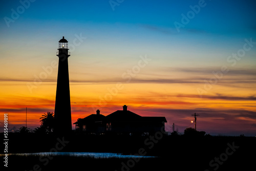 Point Bolivar Lighthouse at sunset; Point Bolivar, Texas, United States of America photo