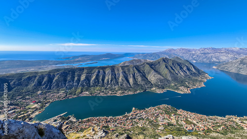 Panoramic view from Pestingrad (Derinski Vrh) of Kotor bay in sunny summer, Adriatic Mediterranean Sea, Montenegro, Balkan Peninsula, Europe. Fjord winding along coastal towns. Lovcen, Orjen mountains