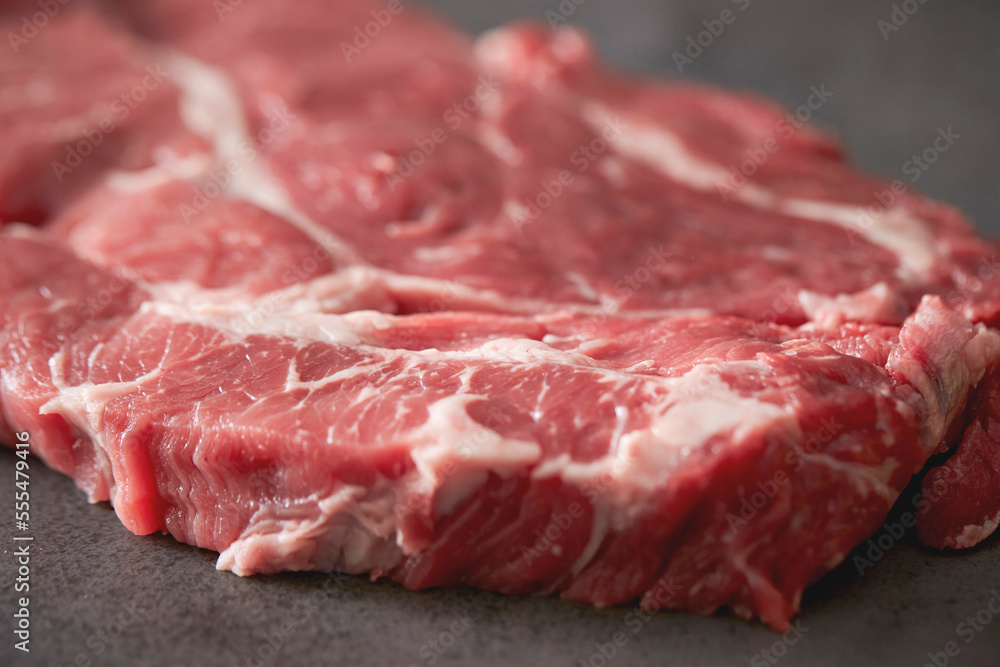 raw meat on a dark background