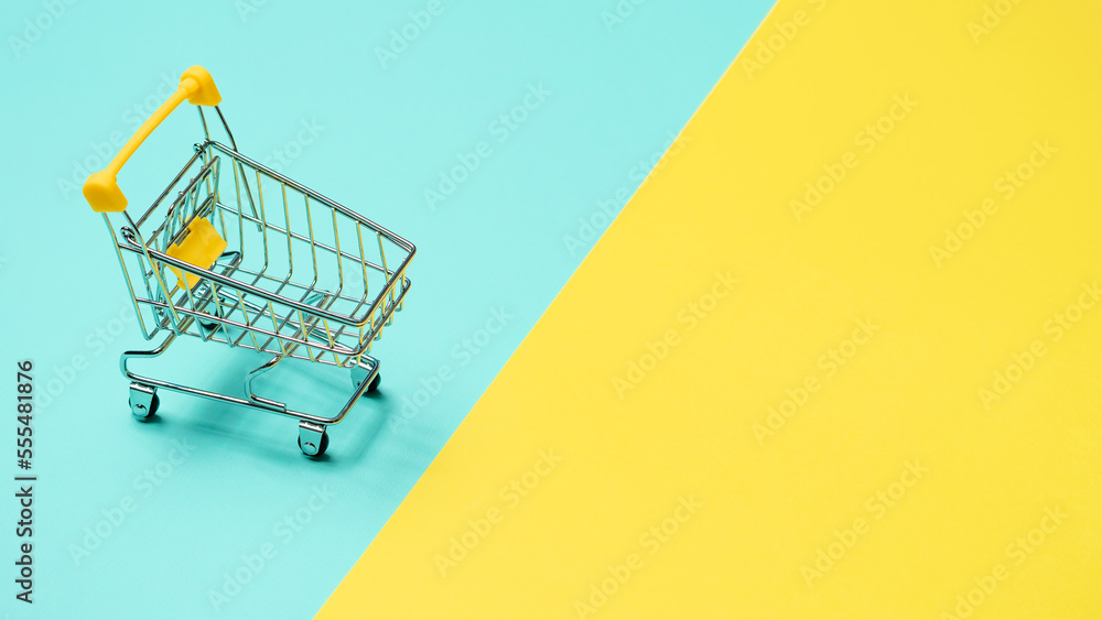 Empty inverted shopping cart, copy space