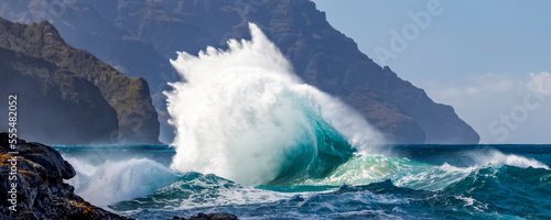 Tropical ocean waves crashing and splashing, Na Pali Coast; Kauai, Hawaii, United States of America photo