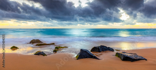 Sunrise over beach and ocean; Kauai, Hawaii, United States of America
