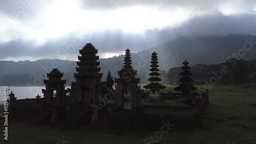 Aerial: Traditional Balinese Temple - Pura Ulun Danu Tamblingan. 4K Cinematic Travel Footage. Bali, Indonesia. photo