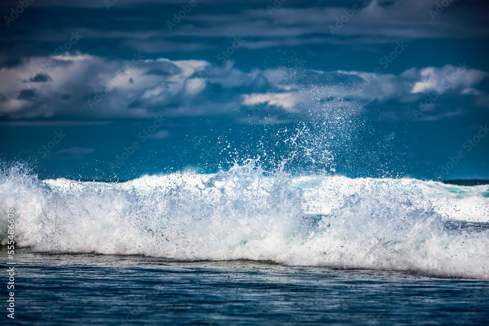 Small waves of the surf splashing at the shore; Kauai, Hawaii, United States of America Small waves of the surf splashing at the shore; Kauai, Hawaii, United States of America
