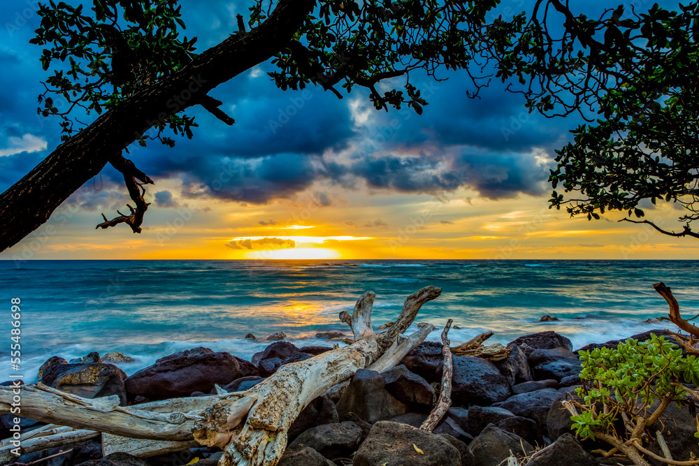 Sunrise over the Pacific Ocean from the shore of Lydgate Beach; Kapaa, Kauai, Hawaii, United States of America Sunrise over the Pacific Ocean from the shore of Lydgate Beach; Kapaa, Kauai, Hawaii, United States of America