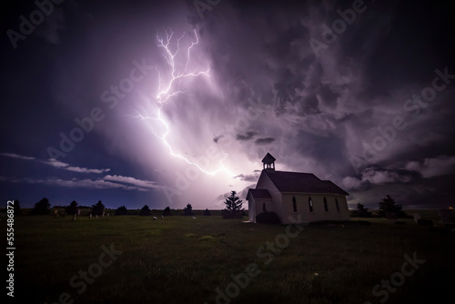 Beautiful and bright electrical storm with a church in the foreground; Moose Jaw, Saskatchewan, Canada photo