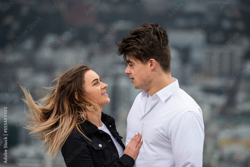 Portrait of a young couple talking face to face; Wellington, North Island, New Zealand Portrait of a young couple talking face to face; Wellington, North Island, New Zealand