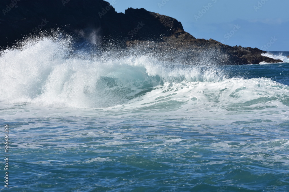 The blue of the sea and the waves meet the horizon The blue of the sea and the waves meet the horizon