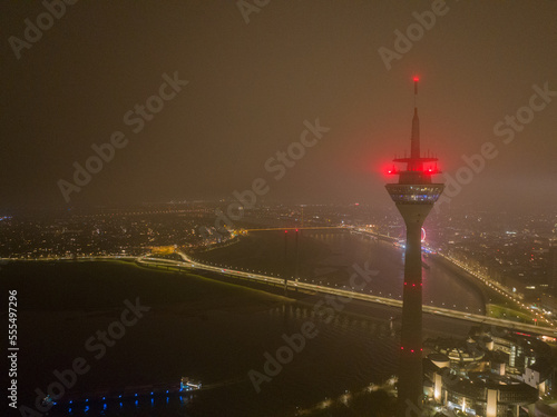 Dusseldorf skyline city overhead view, river rhine, Rheinknie bridge, Rheinturm observation tourist attraction and broadcasting tower. Aerial drone view. photo