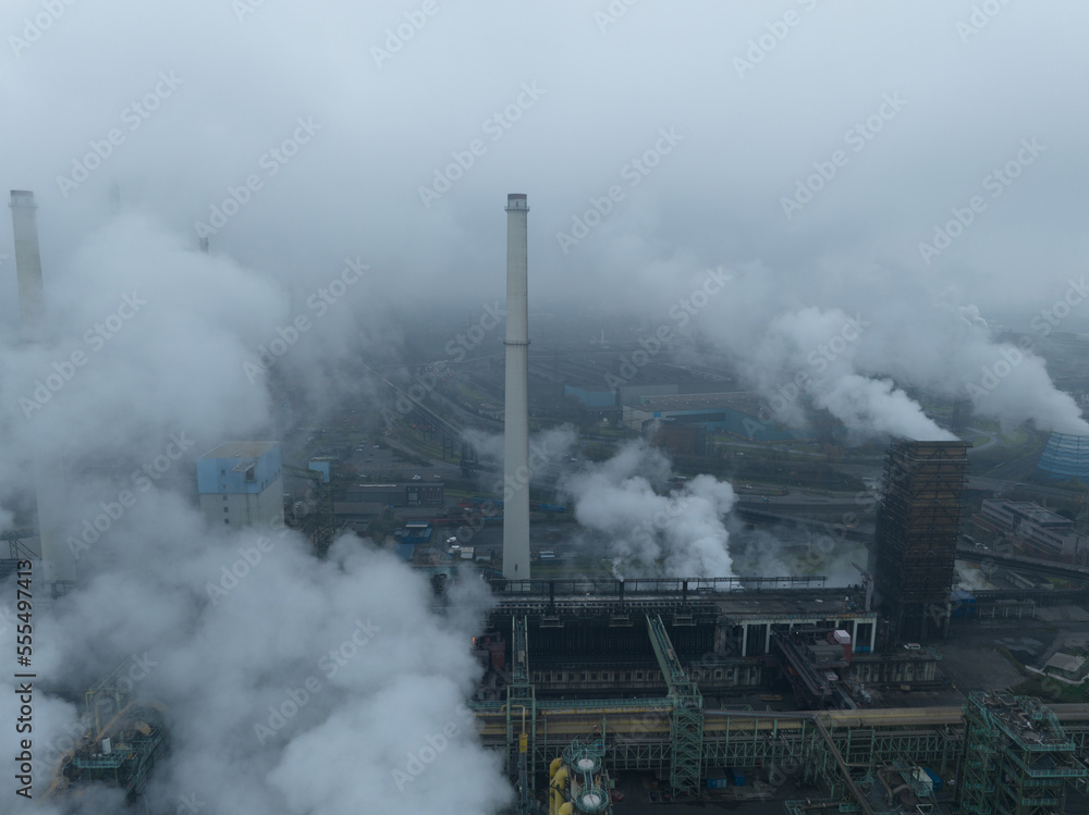 Fototapeta premium Ruhr area, Heavy industrial area near Dusseldorf. Coal mines, blast furnaces, steel mills, German industrial engineering and steel production. Aerial drone overhead view.