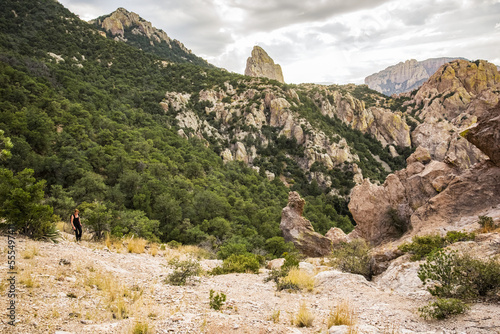 Woman hiking in the Chiricahua Mountains above Cave Creek Canyon near Portal; Arizona, United States of America photo