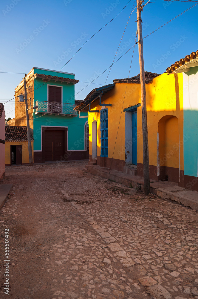 Colorful buildings on cobblestone street, Trinidad, Cuba, West Indies, Caribbean Colorful buildings on cobblestone street, Trinidad, Cuba, West Indies, Caribbean
