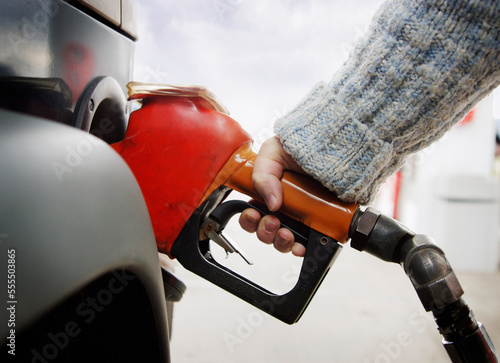 Person Pumping Gas photo