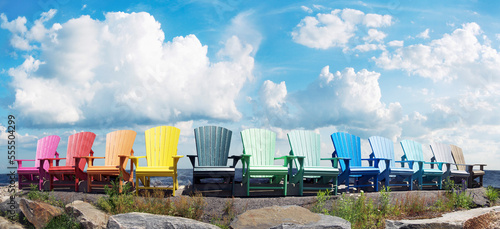 Muskoka Chairs by Lake photo