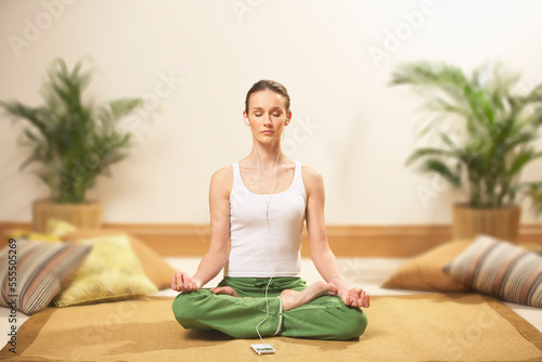 Woman Meditating and Listening to Music photo