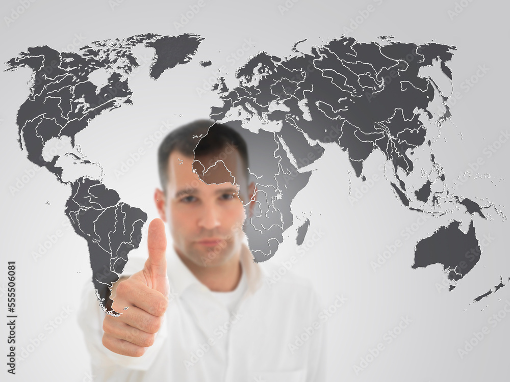 Portrait of Man Giving Thumbs Up in Front of World Map Portrait of Man Giving Thumbs Up in Front of World Map