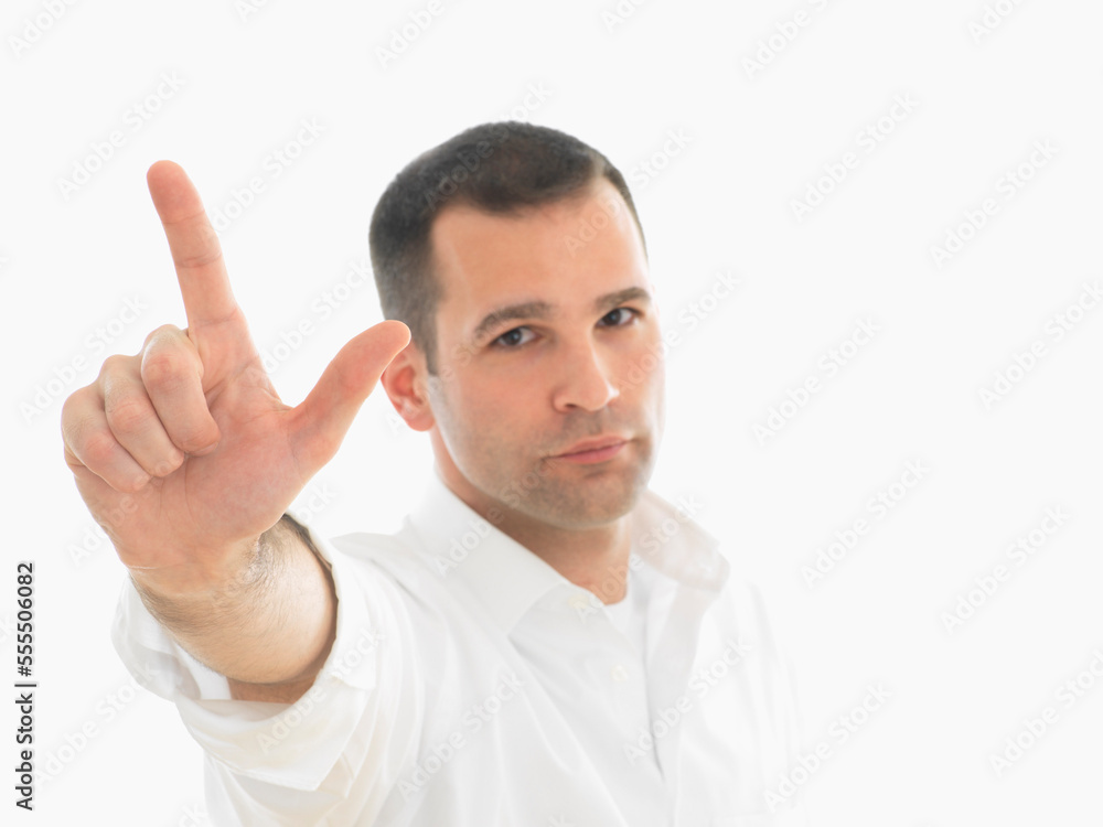 Portrait of Man Holding up Two Fingers Portrait of Man Holding up Two Fingers