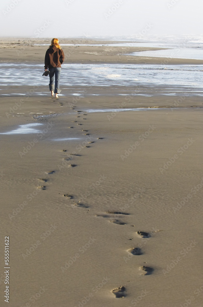 Woman Walking Along Beach, Humboldt Coast, California, USA Woman Walking Along Beach, Humboldt Coast, California, USA