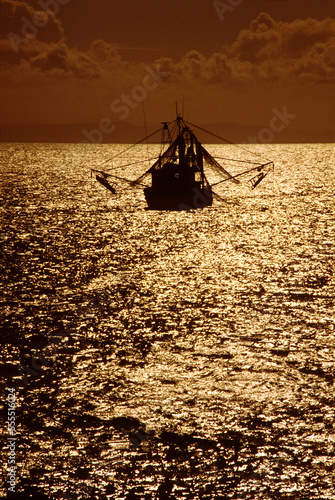 Fishing Boat at Sea, Sunset Silhouette photo