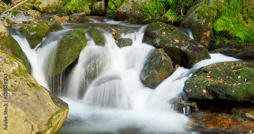Close-up detail of a river flowing over rocks in autumn, Bavarian Forest Natioanl Park, Bavaria, Germany Close-up detail of a river flowing over rocks in autumn, Bavarian Forest Natioanl Park, Bavaria, Germany