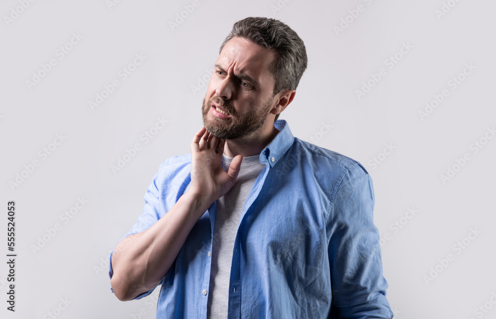 man suffer from itching pain in studio. photo of man with itching pain. man with itching pain. man suffer from itching pain in studio. photo of man with itching pain. man with itching pain.