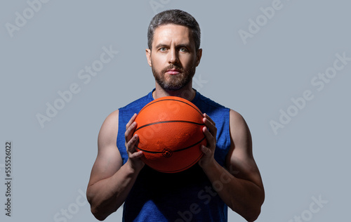 athlete man basketball player in studio. photo of athlete man basketball player with ball.