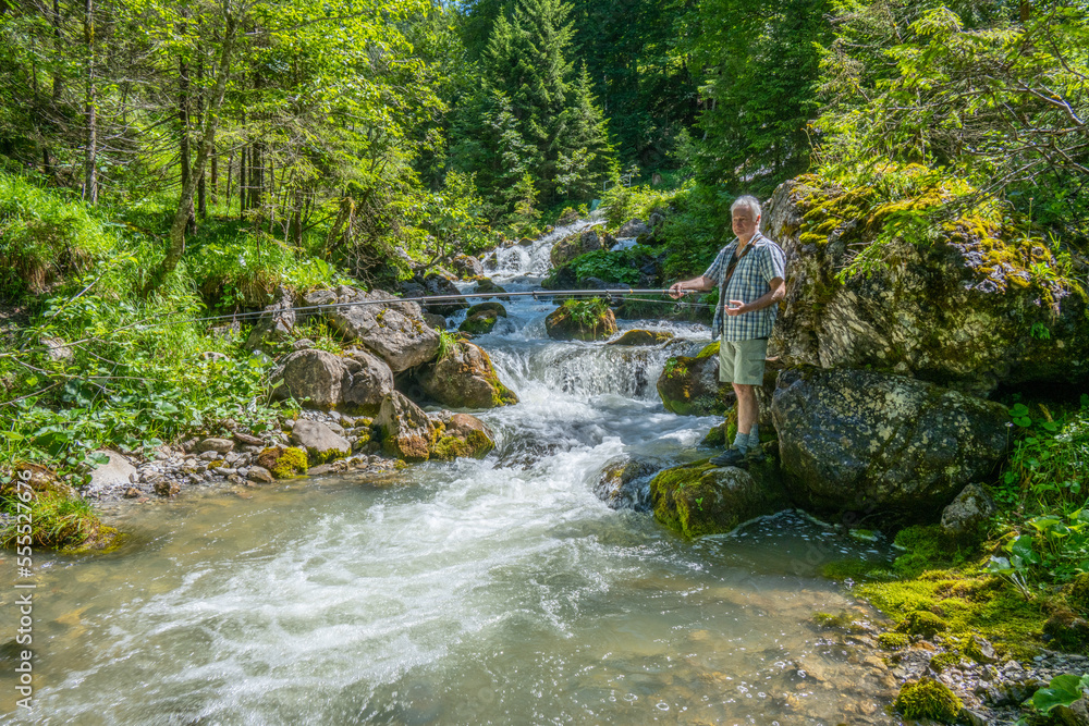 Fishing in the Grosswalsertal, Marultal, at Laguzbach, State of Vorarlberg, Austria Fishing in the Grosswalsertal, Marultal, at Laguzbach, State of Vorarlberg, Austria