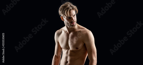 muscular man with fitness abs isolated on black background. man with muscular abs