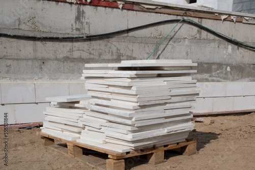 Pallet of wall tiles, uncompleted working, building material on construction site in Israel.