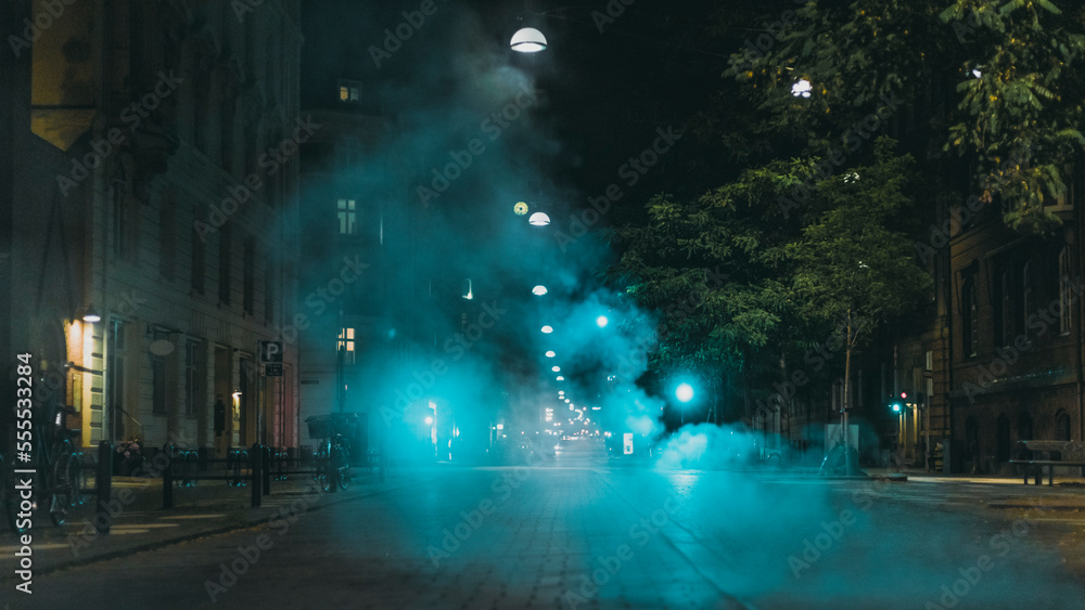 blue steam over night city street