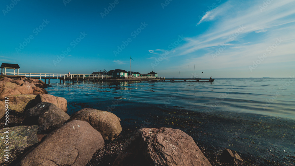 seaside with pier and rocks