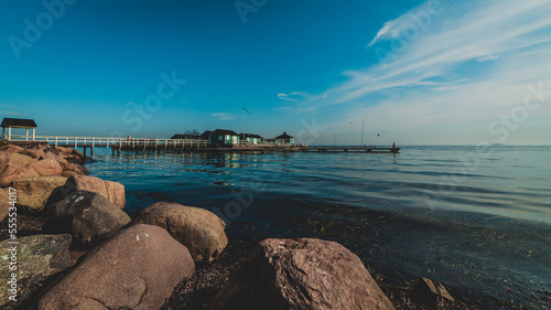 seaside with pier and rocks