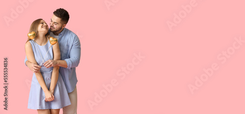 Happy young couple with hea...